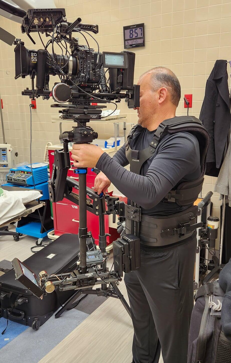 Paul O' Connor readies his steadicam setup for a hospital scene.