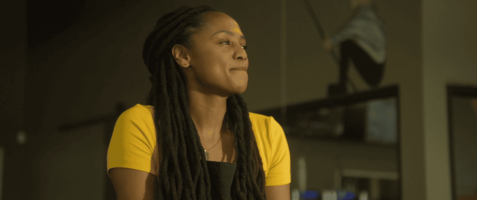 A proud hard working woman looks off into the distance in a production still from the motion picture, "The Remedy for a Broken Heart" produced in association with Tame Rabbit.